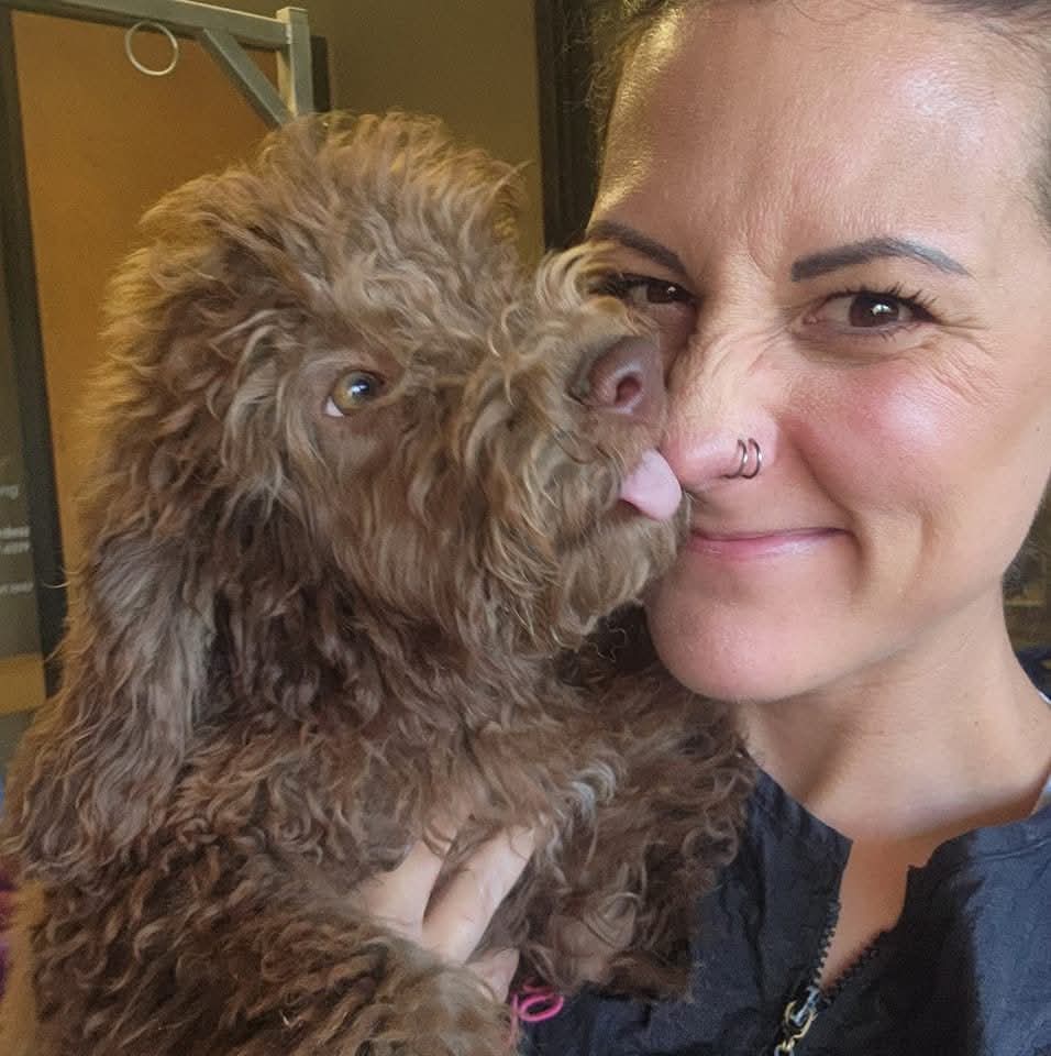 Lori and brown dog